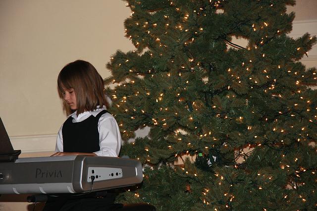 file0007.jpg - Emilia plays the piano.....she is good.....yes.....
